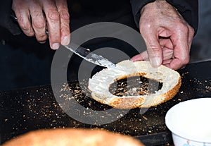 Simit is a Turkish loop-shaped bread, encrusted with sesame seeds, Cracknel and Gevrek photo
