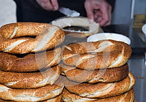 Simit is a Turkish loop-shaped bread, encrusted with sesame seeds, Cracknel and Gevrek photo