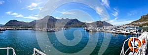 Simon`s Town pier panorama view to go see Seal`s island in Cape Town South Africa nature attraction