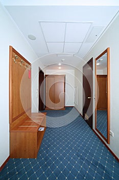 Simple antechamber with wooden closet, mirror photo