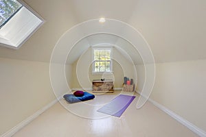 Simple attic room with yoga and meditation set up