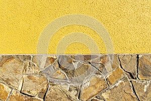 Simple background house wall textured material concrete yellow color and brown stone architecture design concept with copy space
