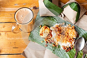 Simple banana leaf nasi lemak and teh tarik breakfast