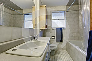 Simple bathroom with tile floor and window.