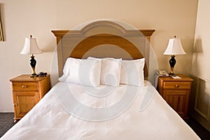 Simple bed, headboard, nightstands, lamps