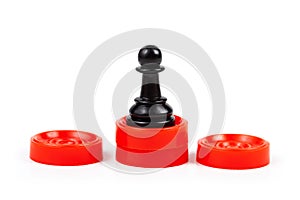 Simple black chess piece, pawn standing on a red podium, first place the best player, employee, winner, 1st place abstract