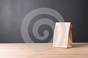 simple brown paper bag for lunch or food on table