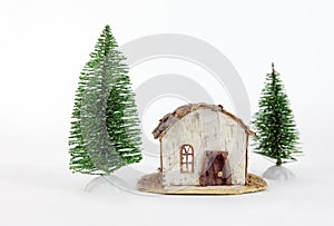simple cabin and fir trees decoration
