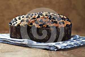 Simple Cake with Bilberries on wooden background.