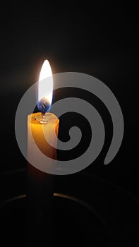 simple candle in dark photo