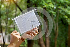 A simple clinometer made from paper is a device for easily measuring the height of objects