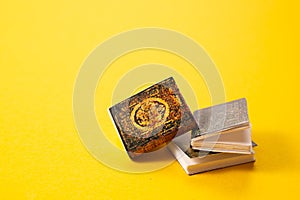 A simple composition of books on yellow background