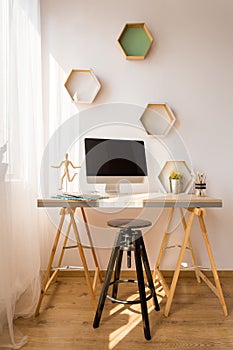 Simple desk and black stool