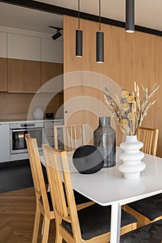 Simple dining table next to kitchen