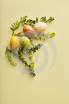 simple easter composition on a green background. flat lay with space for text