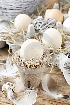 Simple easter decoration with egg and hay wreath