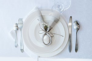 Simple festive Easter table setting with napkin Easter Bunny for one person