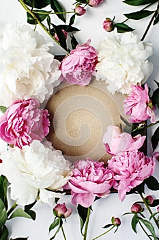 Simple flat lay flower frame of pink and white peonies