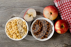 The simple food composition with apples and corn flacks
