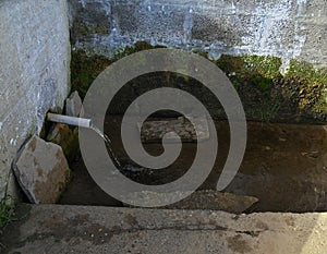 Simple fountain flowing with clear mountain water