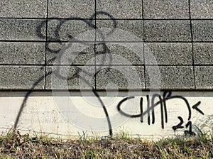 Simple graffiti abstract comic girl mouse face in black on noise barrier wall