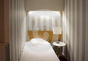 Simple hotel room, single bed