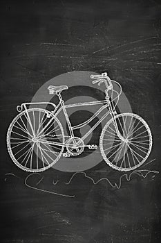 A simple illustration of a bicycle drawn on a blackboard