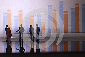 Simple Illustration Photo,Gruap of Man and Woman doing a Business meeting with graphic Chart as a background