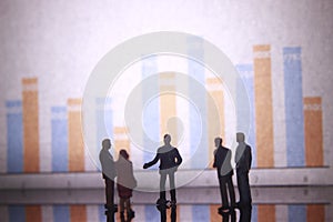 Simple Illustration Photo,Gruap of Man and Woman doing a Business meeting with graphic Chart as a background
