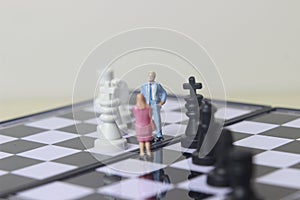 Simple illustration for photo War, Battle or politic situation concept, 2 standing mini figure, man and woman negoitation or