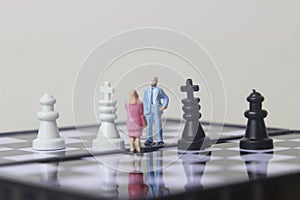 Simple illustration for photo War, Battle or politic situation concept, 2 standing mini figure, man and woman negoitation or photo