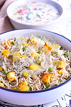 Simple Indian vegetarian meal - Pulao and raita photo