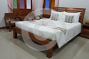 Simple interior bed room with wooden bad in a resort