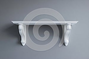 A simple interior design setting features a minimalist white shelf mounted on a light gray wall