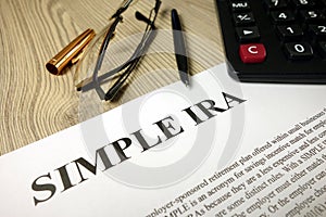 Simple ira document with pen calculator and glasses