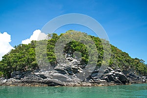 Simple island with pancake rock and transparent sea