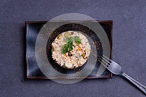 Simple italian spring risotto on dark background with bottarga on dark background. spring season italian food