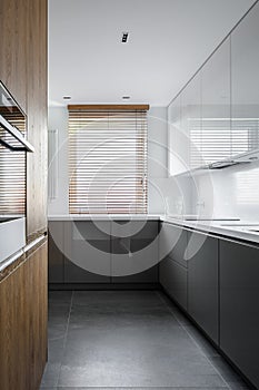 Simple kitchen with wooden blinds