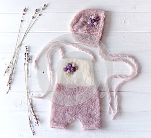 Simple knitted handmade clothes for newborn babies