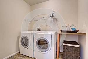 Simple laundry room with washer dryer set.