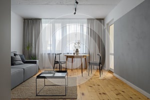 Simple living room with exposed concrete