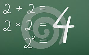 Simple mathematical equation. Two plus two, two times two, two squared equals four