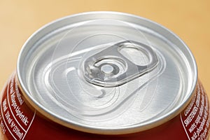 Simple new small closed unopened 330 ml metal can of soda, macro, top part extreme closeup, object detail. Carbonated drinks