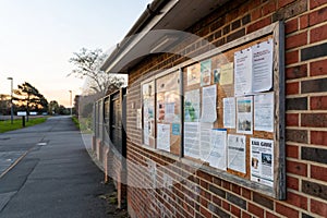 Notice board on brick wall