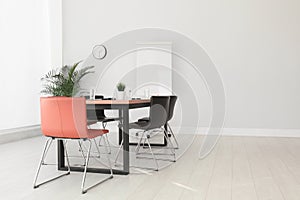 Simple office interior with table and chairs