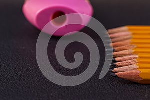 Simple pencils and a pink pencil sharpener