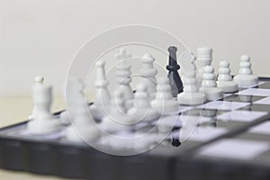 Simple Photo illustration for War, battle or politic situation concept, betrayer beyond the soldier, plastic magnetic small chess,