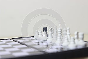 Simple Photo illustration for War, battle or politic situation concept, betrayer beyond the soldier, plastic magnetic small chess,