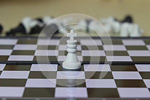 Simple Photo illustration for War, battle or politic situation concept, the winner, plastic magnetic small chess, critical