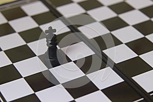 Simple Photo illustration for War, battle or politic situation concept, the winner, plastic magnetic small chess, critical